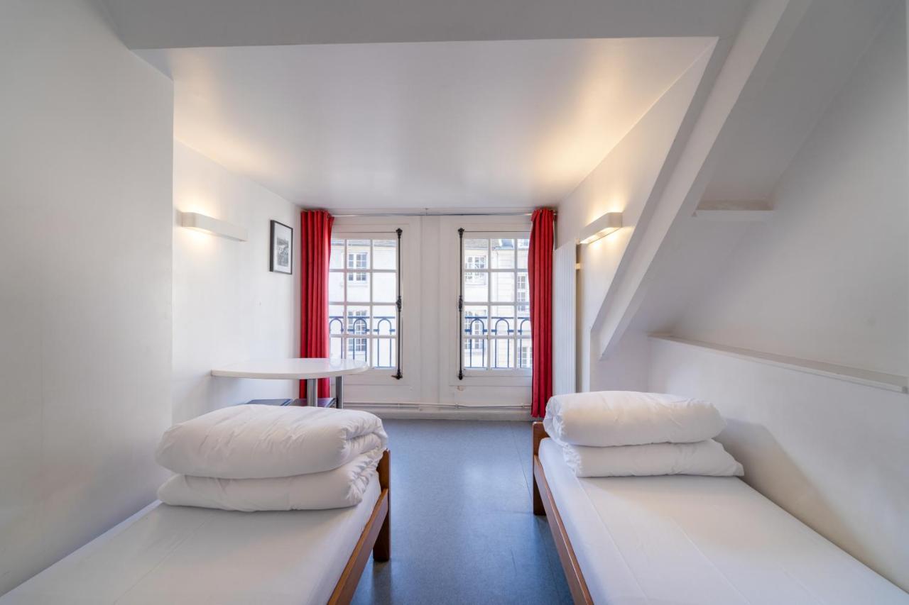 Mije Marais Hostel Paris Bagian luar foto A typical room at the hotel